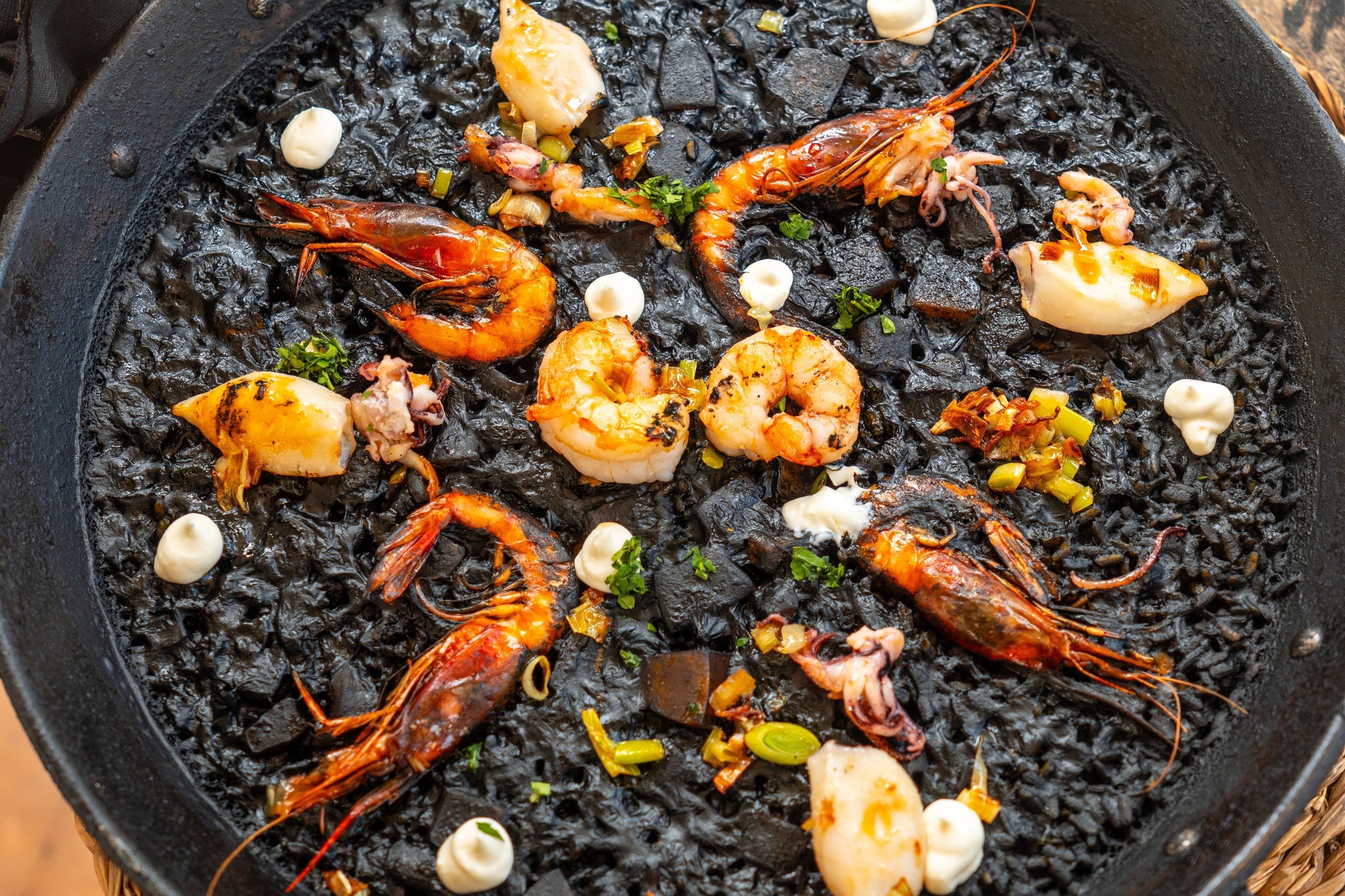 Black Rice Paella with Grilled Prawns and Octopus Legs